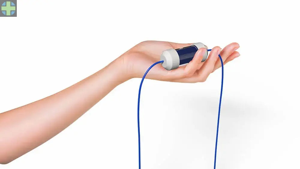 Hand holding Enbio Elite Water Purification Filter, showcasing its compact design with white and blue components. Blue cord extends from the device, emphasizing its connectivity and ease of use for optimal water filtration and sterilization performance.