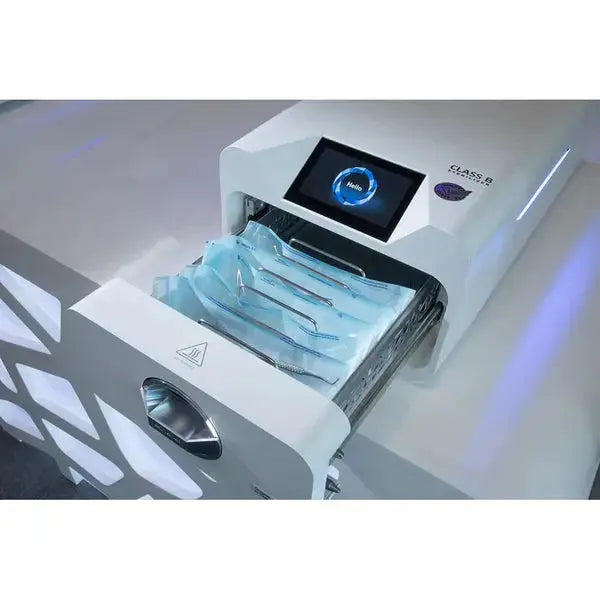 Enbio Pro Elite Class B Autoclave with open drawer containing sterilization pouches, digital display, and sleek white design for efficient medical instrument sterilization in professional settings.